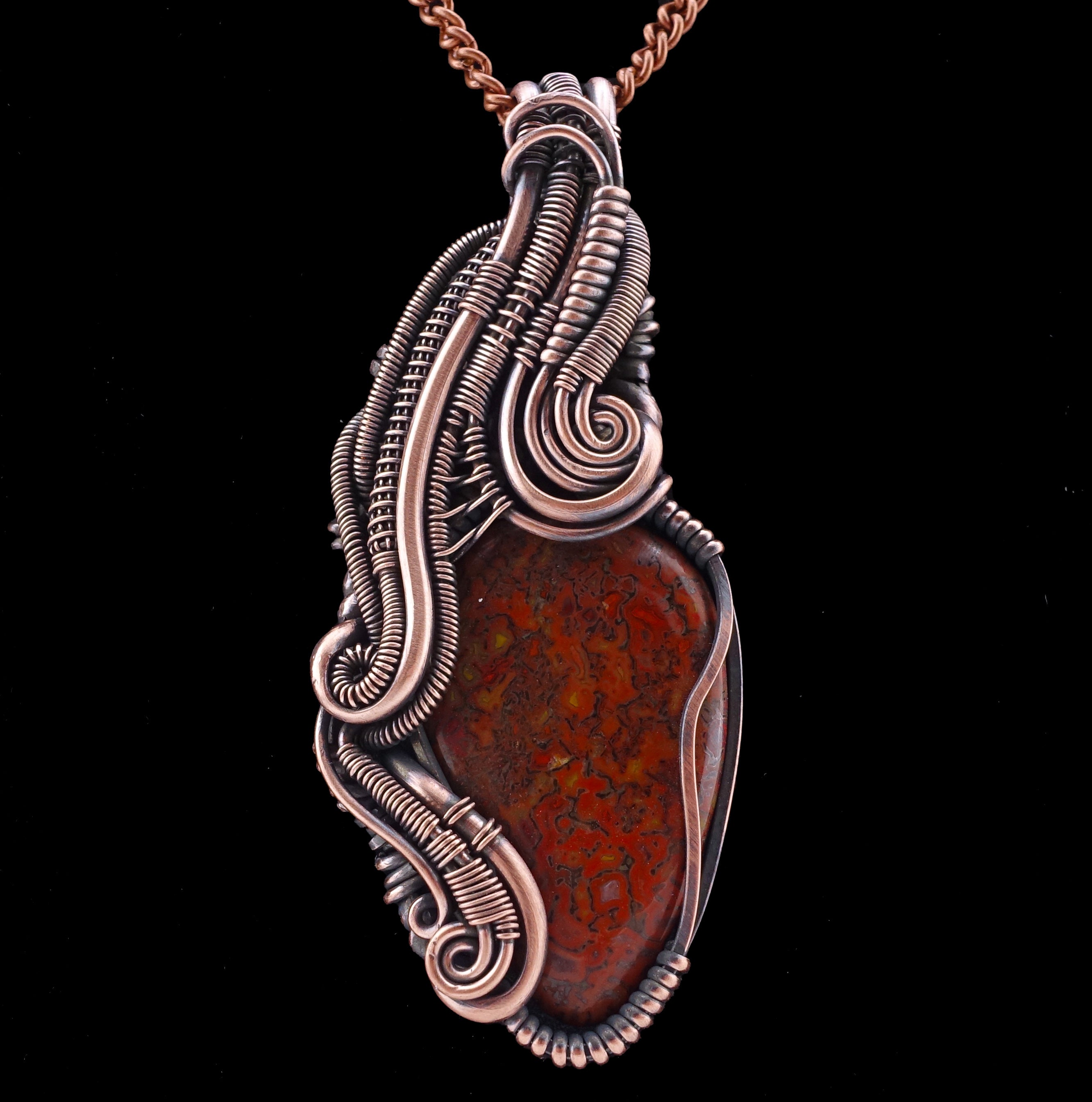 Agatized dinosaur bone “gem bone” copper wire wrapped pendant