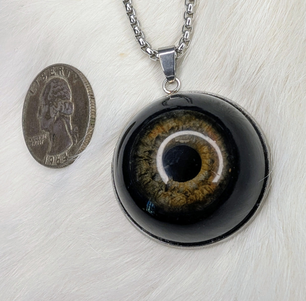 Eye pendant with obsidian pupil