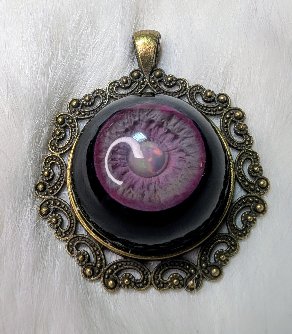 Eye pendant with opal pupil