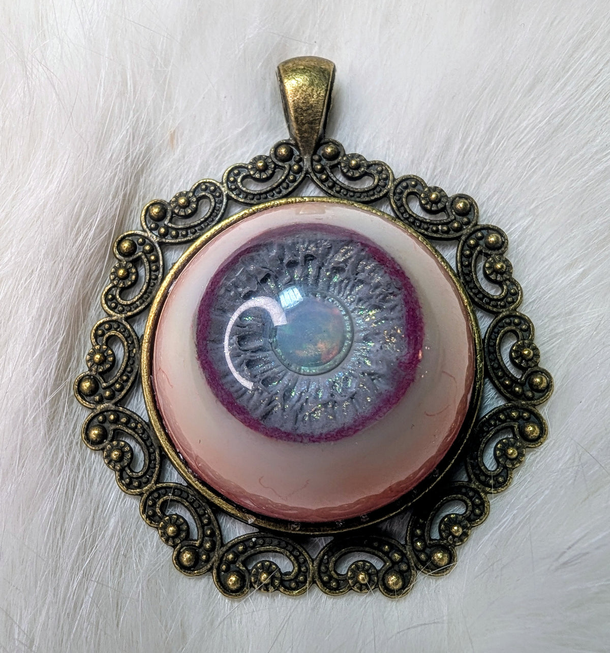 Eye pendant with opal pupil