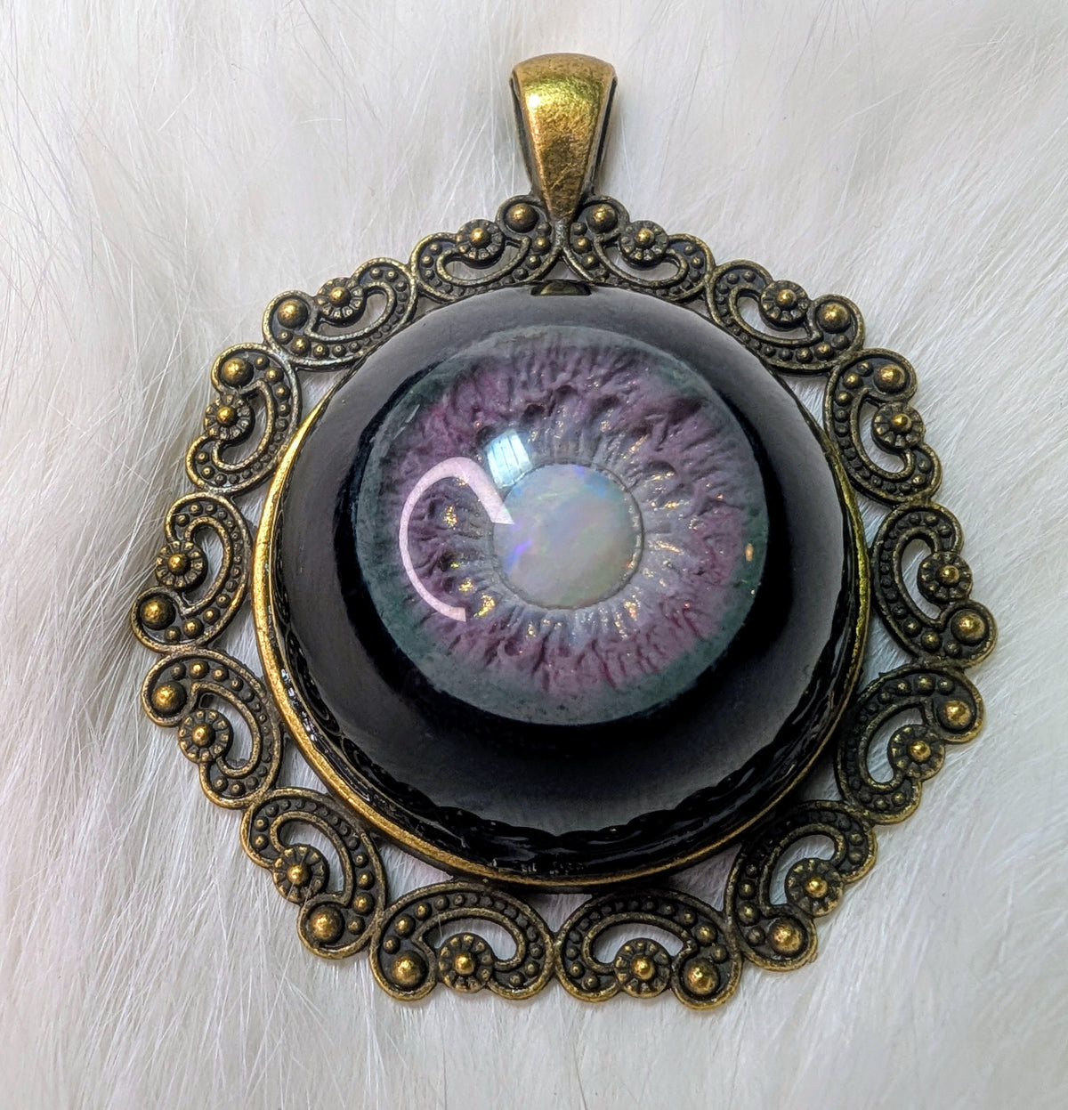 Eye pendant with opal pupil