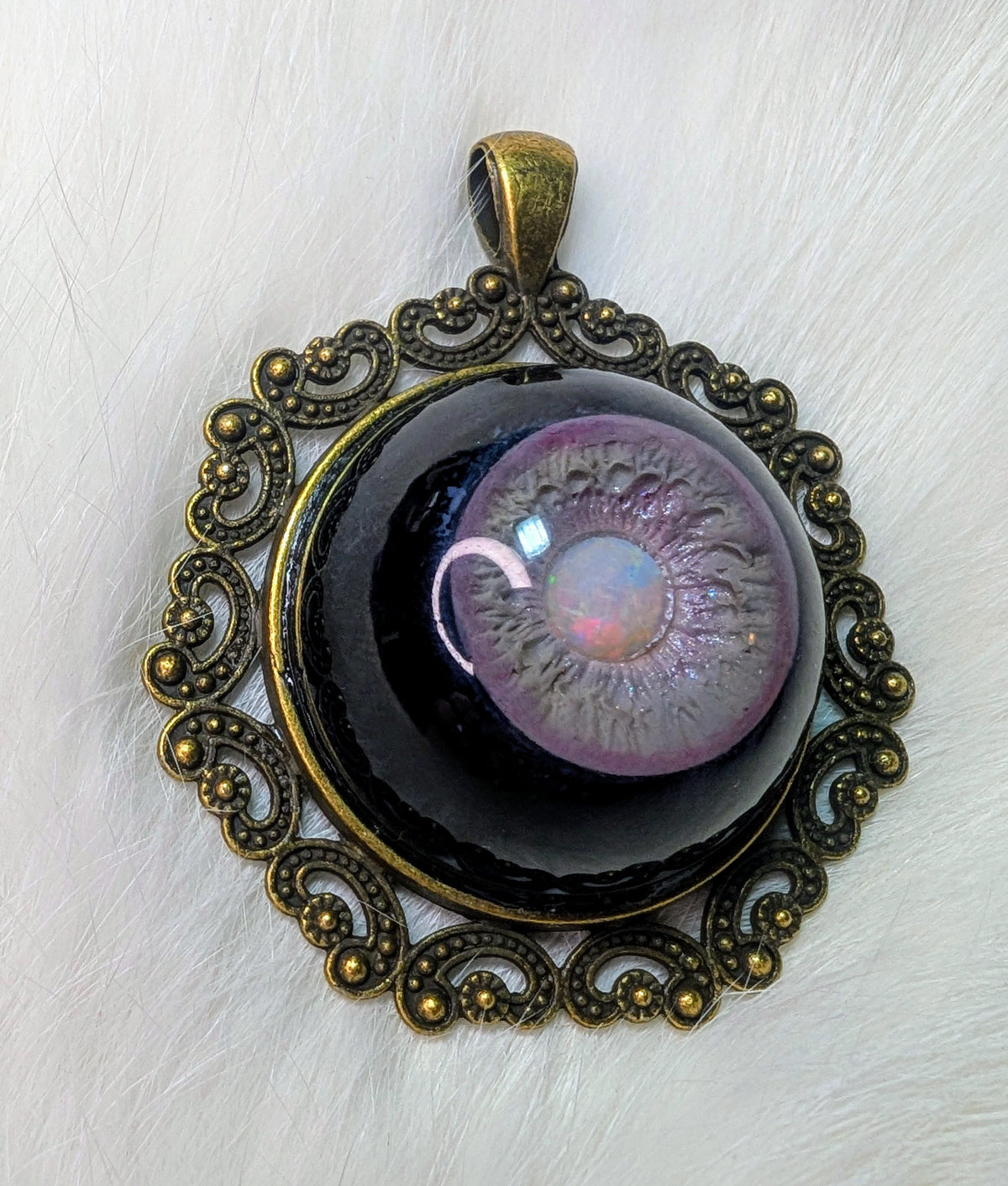 Eye pendant with opal pupil