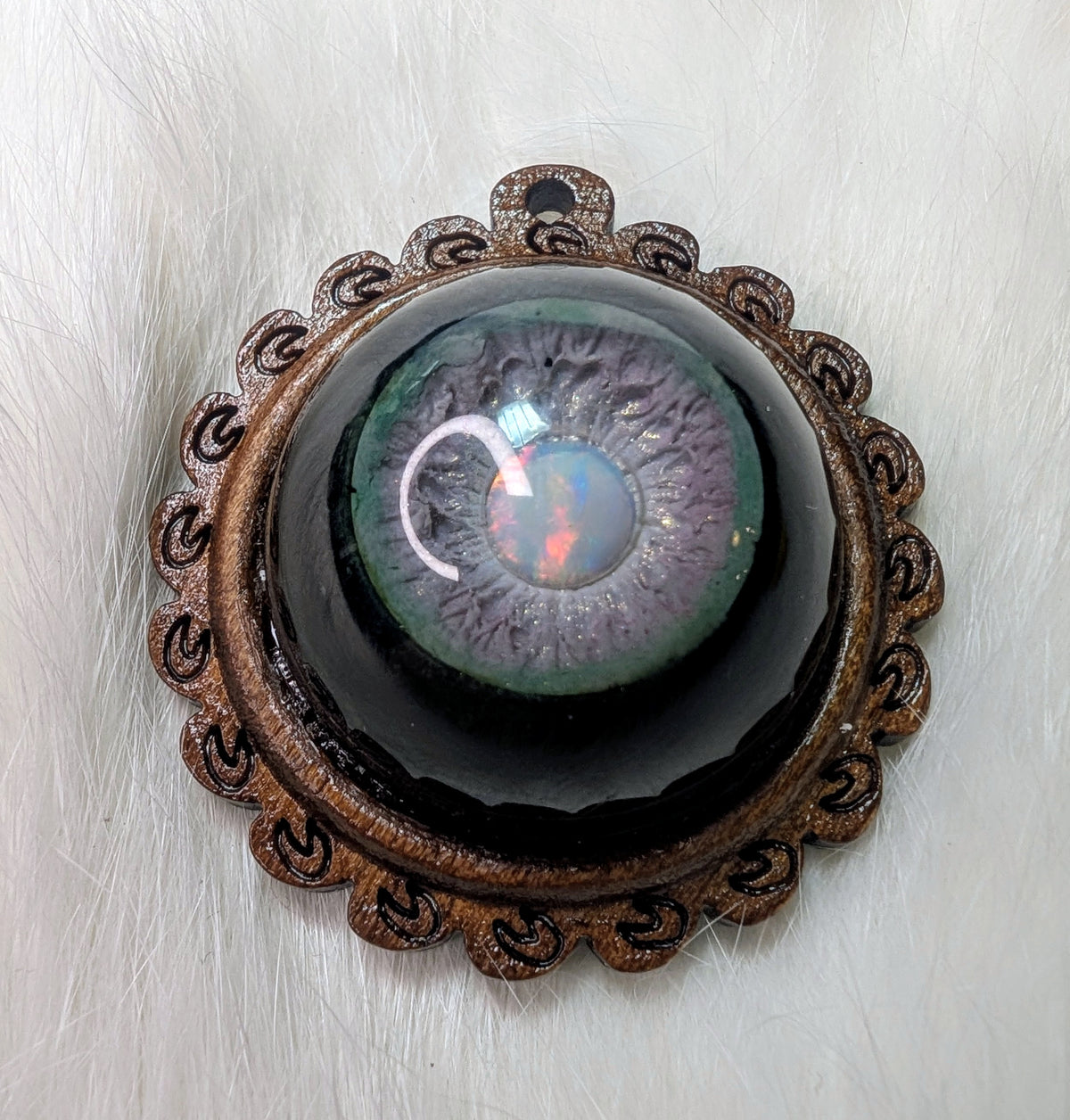 Eye pendant with opal pupil