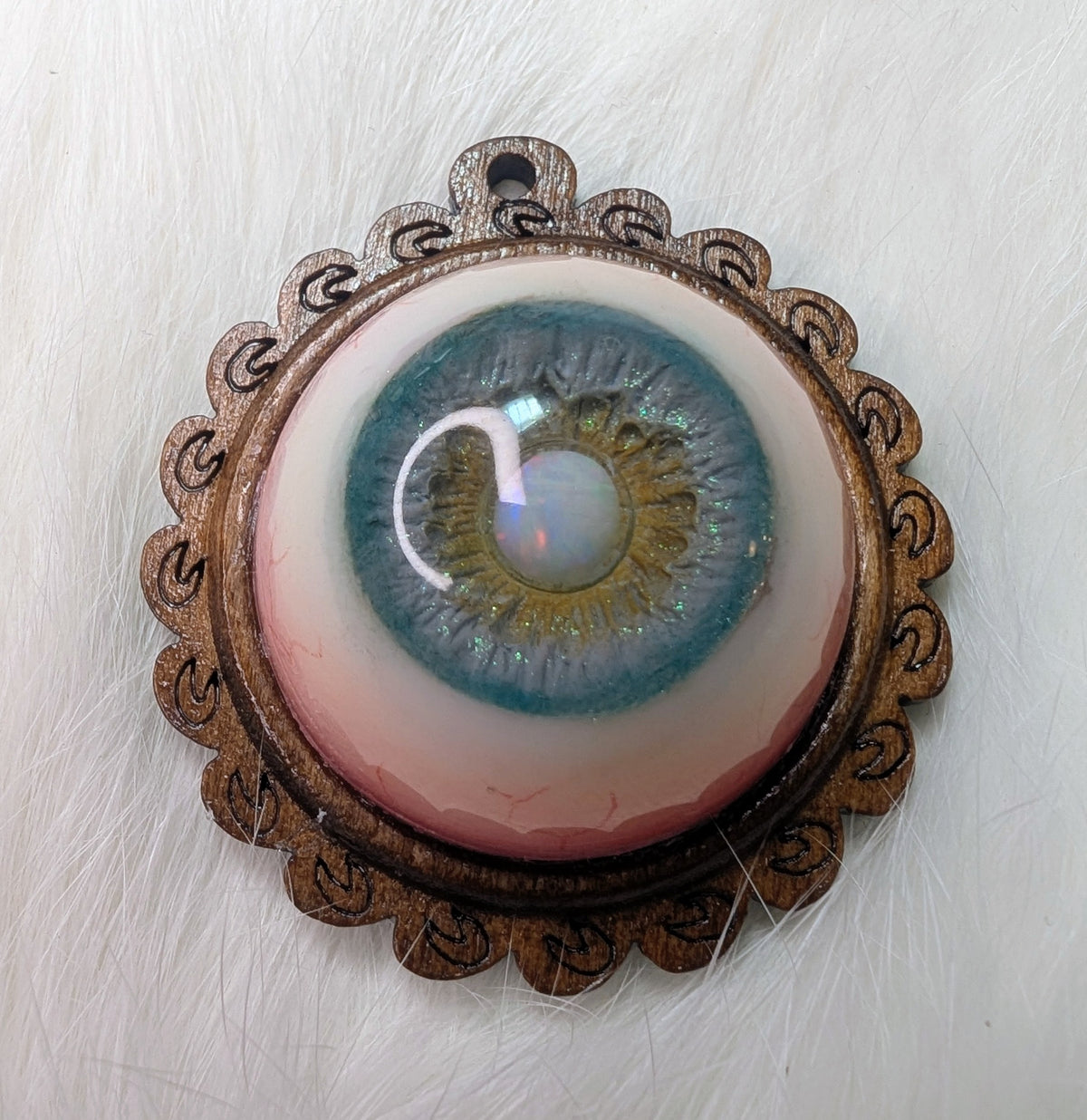 Eye pendant with opal pupil